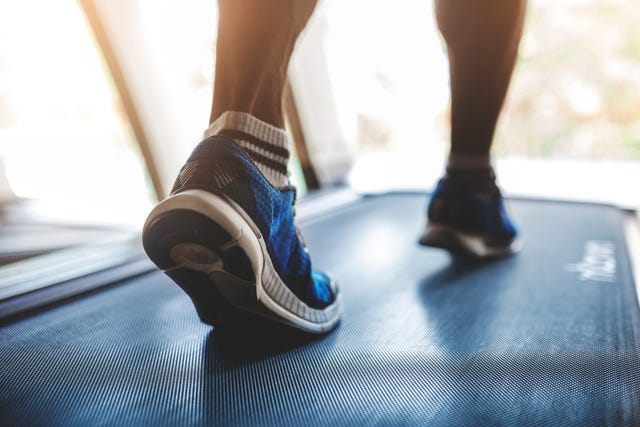 low section of person running on treadmill