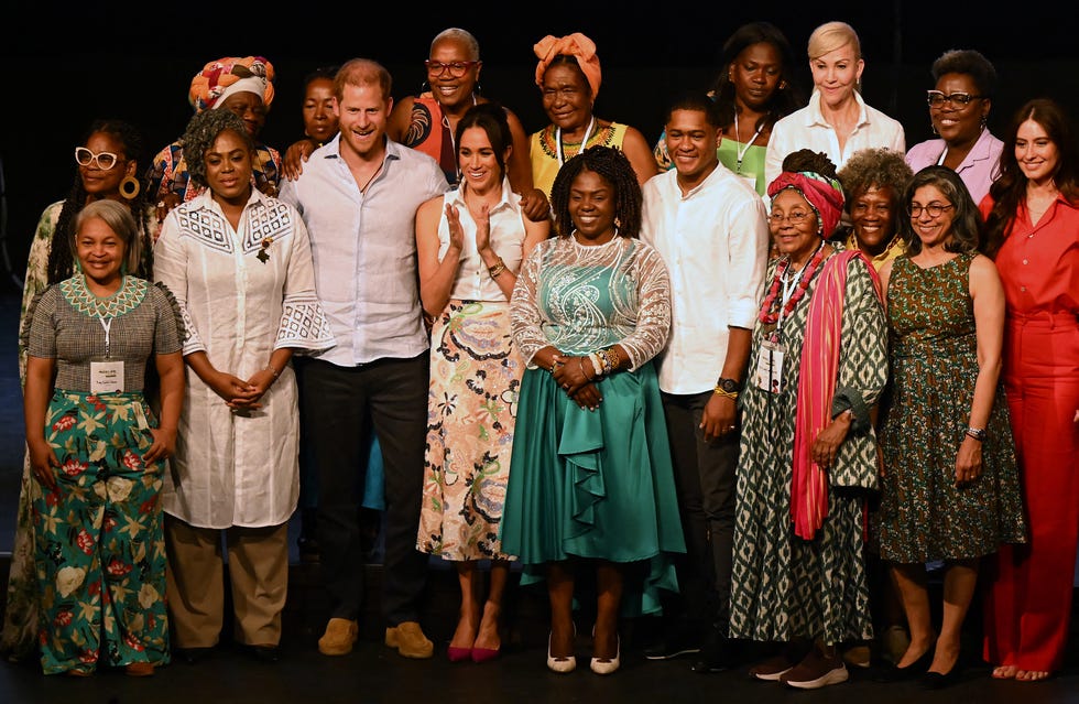 Britain's Prince Harry (3rd from left), Duke of Sussex, and his wife Meghan Markle (4th from left) pose for a photo with Colombia's Vice President Francia Marquez (C) and her partner Yerney Pinillo (CR) and Colombia's former Minister of Education Aurora Vergara (2nd from left) among other participants at the end of the Afro Women and Power Forum at the Municipal Theater in Cali, Colombia, August 18, 2024. Prince Harry and his wife, American actress Meghan Markle, are visiting Colombia at the invitation of Colombian Vice President Francia Marquez, with whom they have participated in various meetings with women and young people to reject discrimination and cyberbullying. Photo by Raul Arboleda (AFP). Photo by Raul Arboleda (AFP) via Getty Images