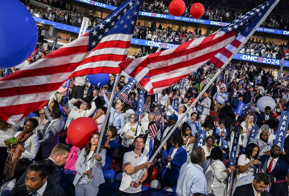 attendees wave the us national flag after us vice president and 2024 democratic presidential candidate kamala harris spoke on the last day of the democratic national convention dnc at the united center in chicago, illinois, on august 22, 2024 kamala harris accepted the democratic presidential nomination in chicago on august 22, before a rapturous crowd, pledging a new way forward and warning that donald trump will take america backward if he wins novembers blockbuster election photo by andrew caballero reynolds afp photo by andrew caballero reynoldsafp via getty images