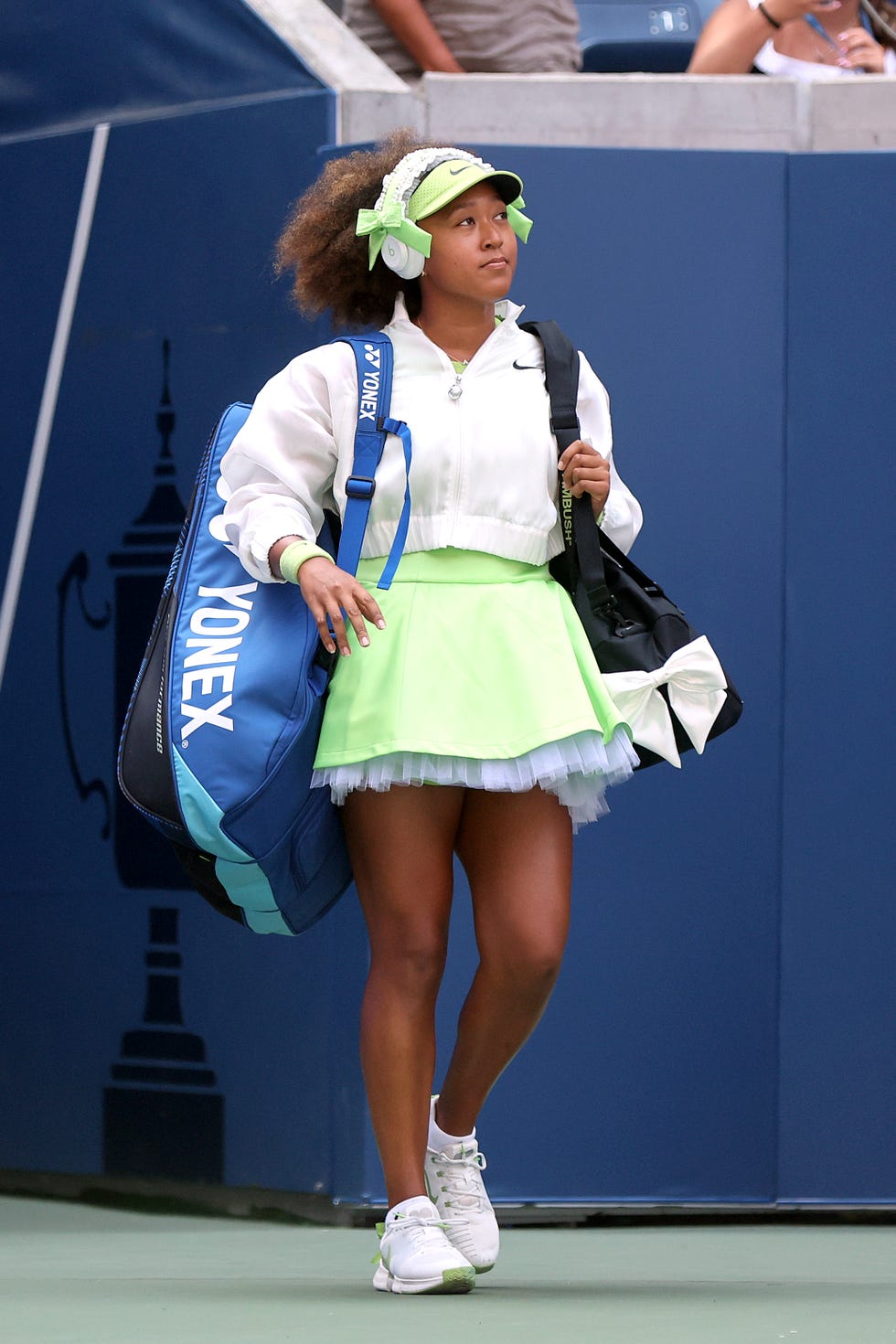 new york, new york august 27 naomi osaka of japan walks on court before playing against jelena ostapenko of latvia during their womens singles first round match on day two of the 2024 us open at the usta billie jean king national tennis center on august 27, 2024 in the flushing neighborhood of the queens borough of new york city photo by mike stobegetty images