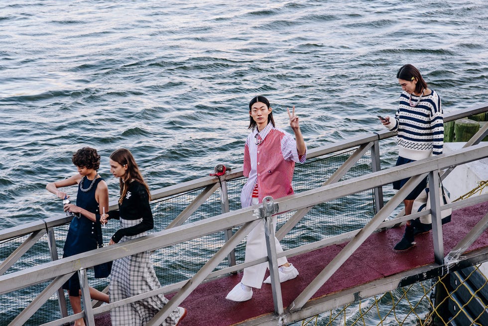 guests board the ferry at tommy hilfiger's spring 2025 show