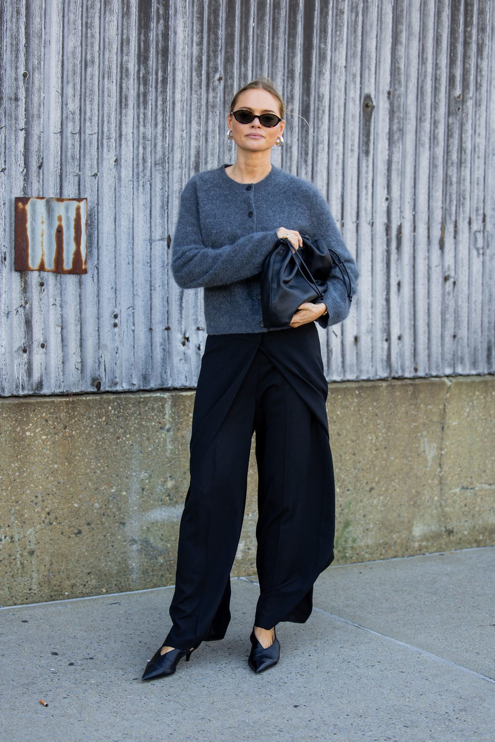 new york, new york september 10 claire rose cliteur wears grey cardigan, black bag, pants outside cos during new york fashion week on september 10, 2024 in new york city photo by christian vieriggetty images