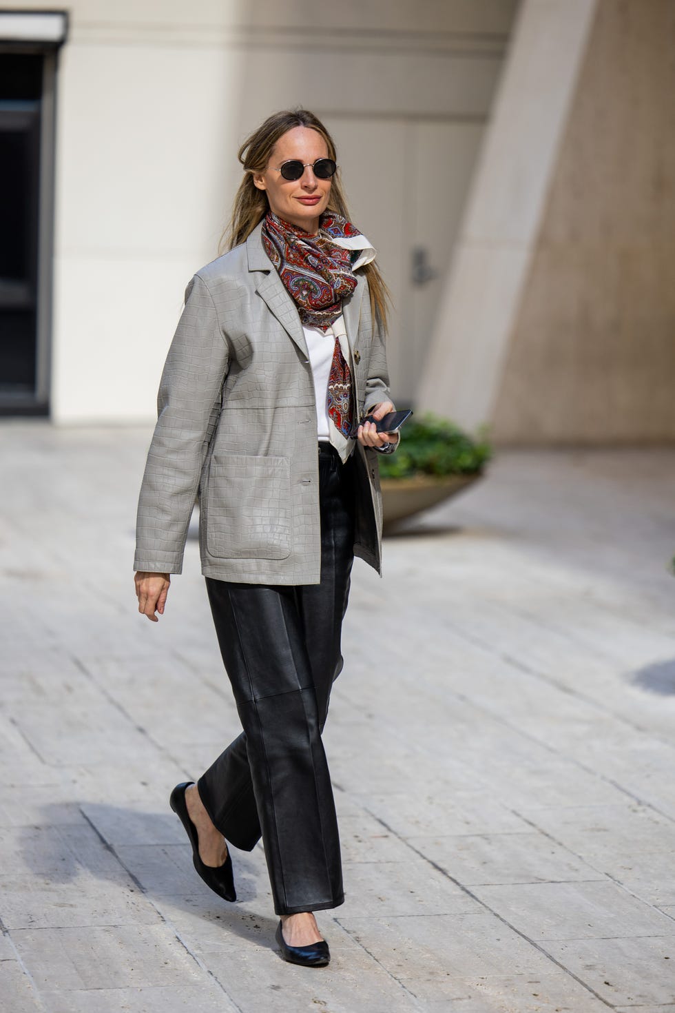 new york, new york september 10 a guest wears grey leather jacket, black leather pants outside toteme during new york fashion week on september 10, 2024 in new york city photo by christian vieriggetty images