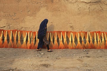 an afghan burqa clad woman walks along a street in fayzabad district of badakhshan province on september 16, 2024 photo by omer abrar  afp