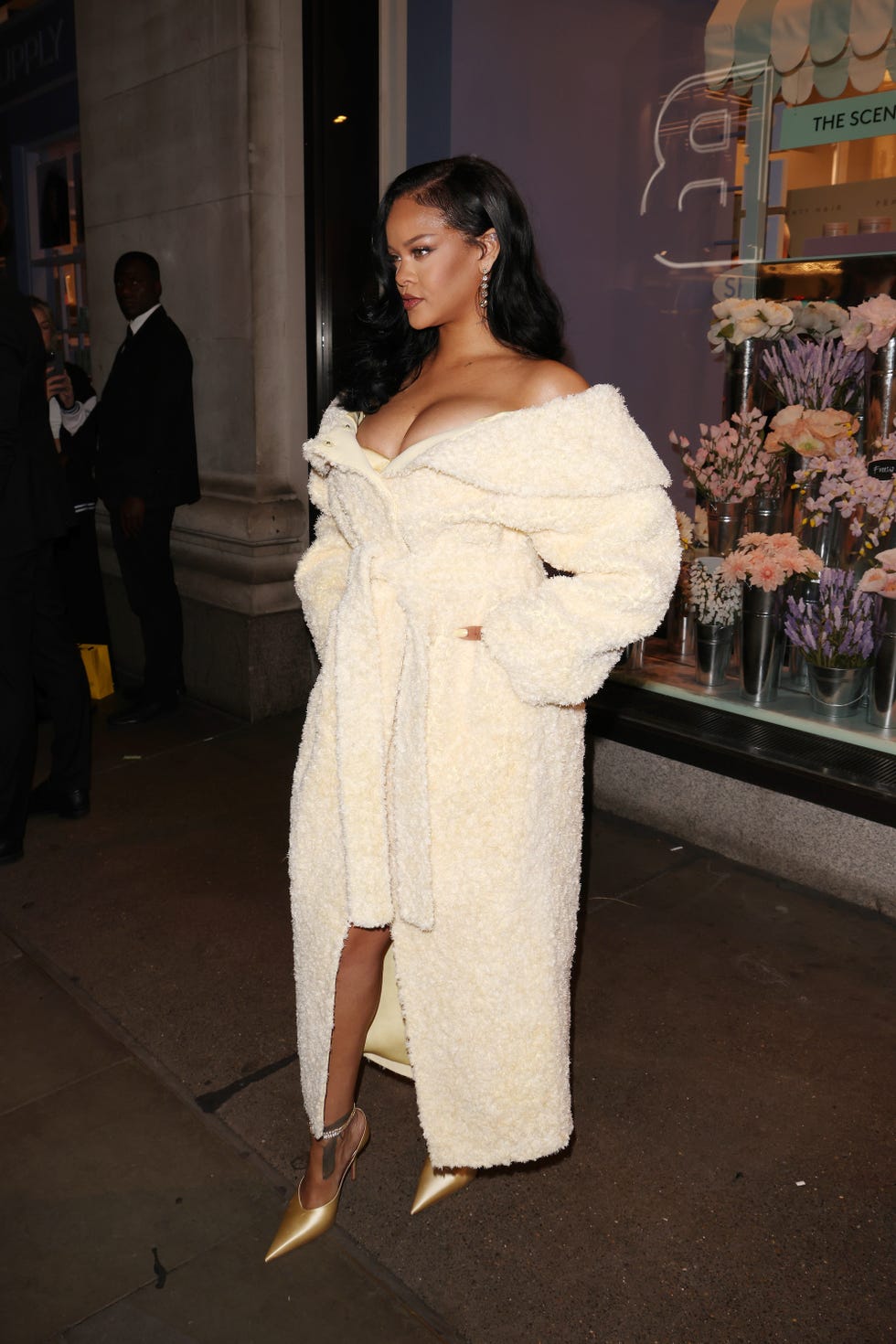 rihanna walks on sidewalk