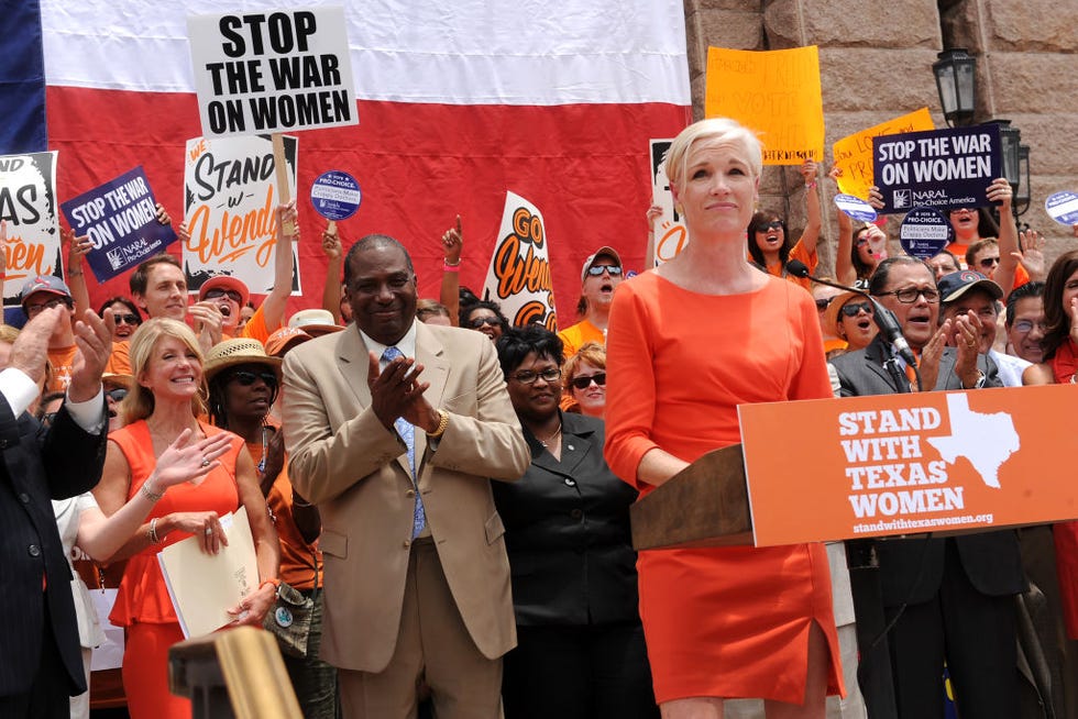 planned parenthood president cecile richards speaks from a lectern during the stand with texas women pro choice womens reproductive health rally at the texas state capitol, austin, texas, july 1, 2013 among those behind her are state senators wendy davis left, in sleeveless orange dress and royce west center left, in beige suit behind them, several people hold signs, including ones that read stop the war on women and stand with wendy the rally took place at the beginning of a second special legislative session after senate bill 5 sb5, restricting abortion access, failed to pass in the previous session, largely due to senator davis filibuster photo by john andersonthe austin chroniclegetty images