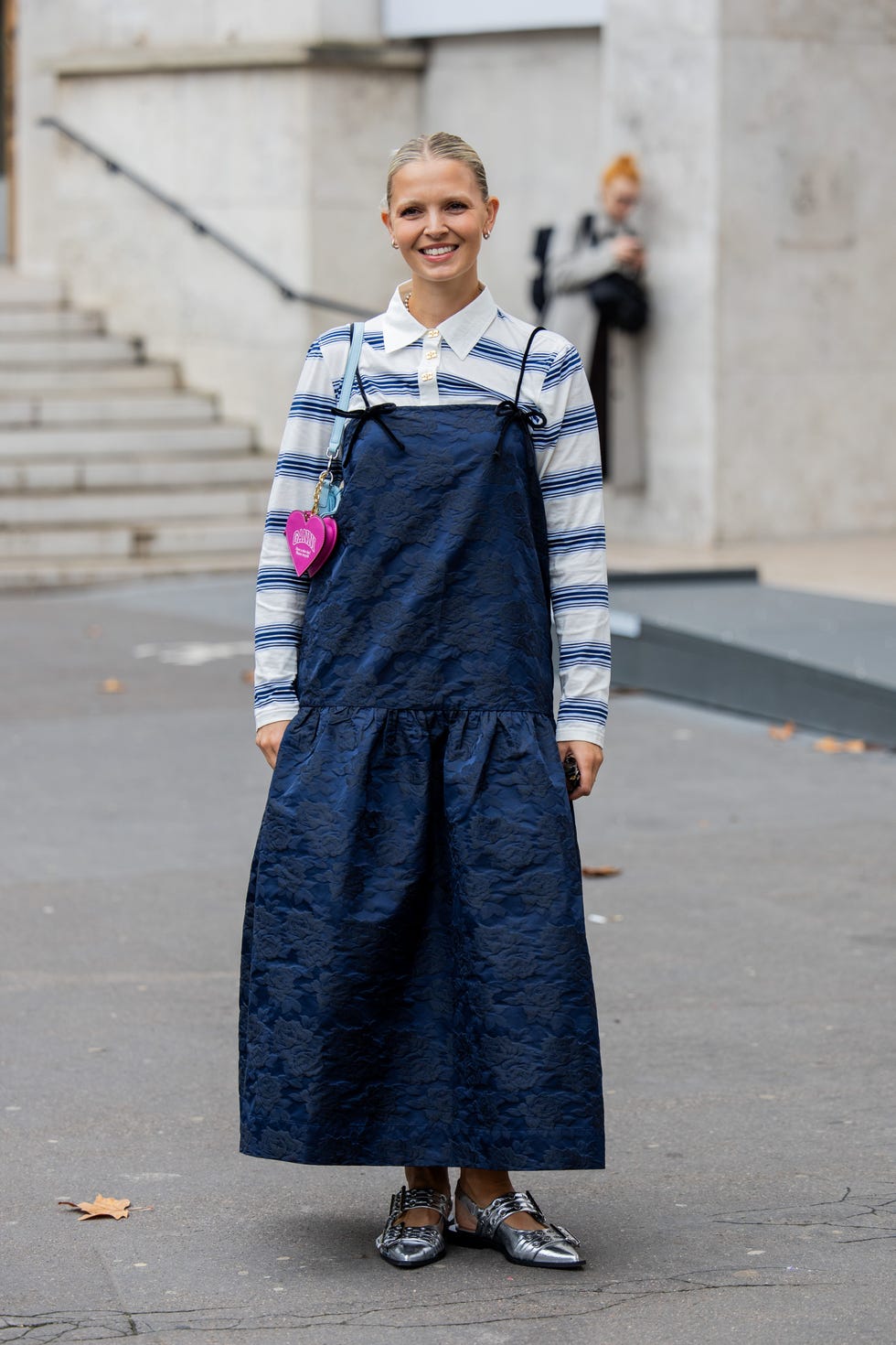 paris, france september 24 hollie mercedes peters wears striped white button shirt, dress, blue bag outside ganni during womenswear springsummer 2025 as part of paris fashion week on september 24, 2024 in paris, france photo by christian vieriggetty images