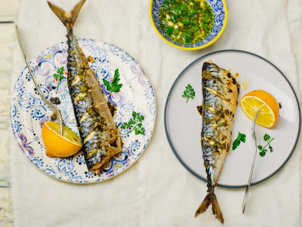 mackerel a grill with a lemon and sauce. healthy food. top view. selective focus.