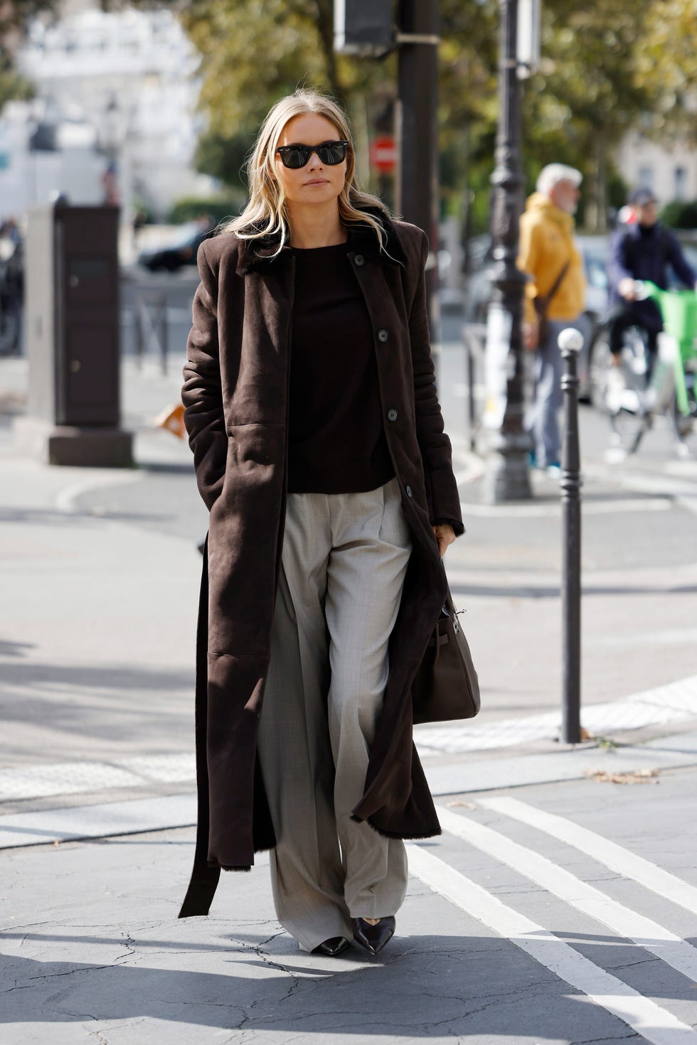 paris, france september 28 claire rose cliteur wears brown top, grey trousers, brown coat, brown hermes bag, outside hermes, during womenswear springsummer 2025 as part of paris fashion week on september 28, 2024 in paris, france photo by claudio laveniagetty images