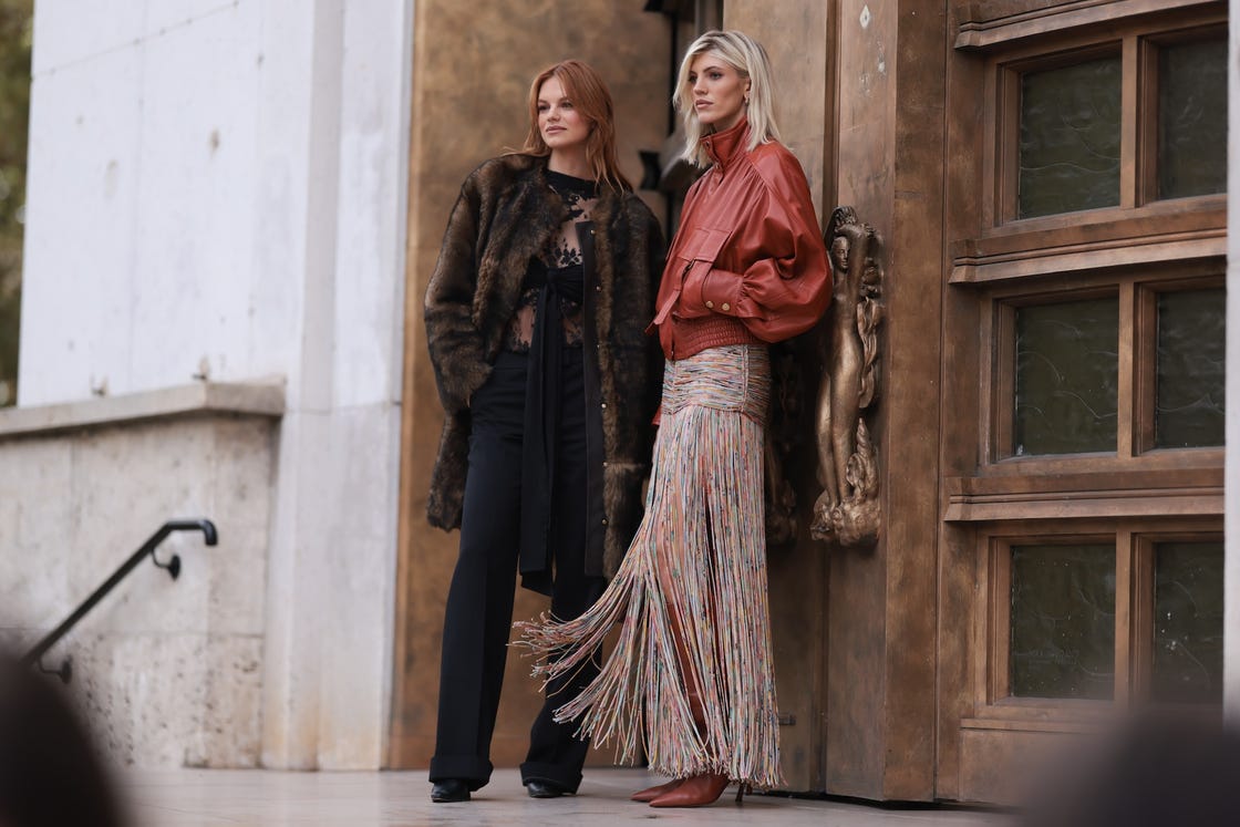 paris, france september 30 devon windsor is seen wearing an orange leather jacket with pockets and several details, a long colorful skirt with fringes and high brown boots during the zimmermann show womenswear springsummer 2025 as part of paris fashion week on september 30, 2024 in paris, france photo by jeremy moellergetty images