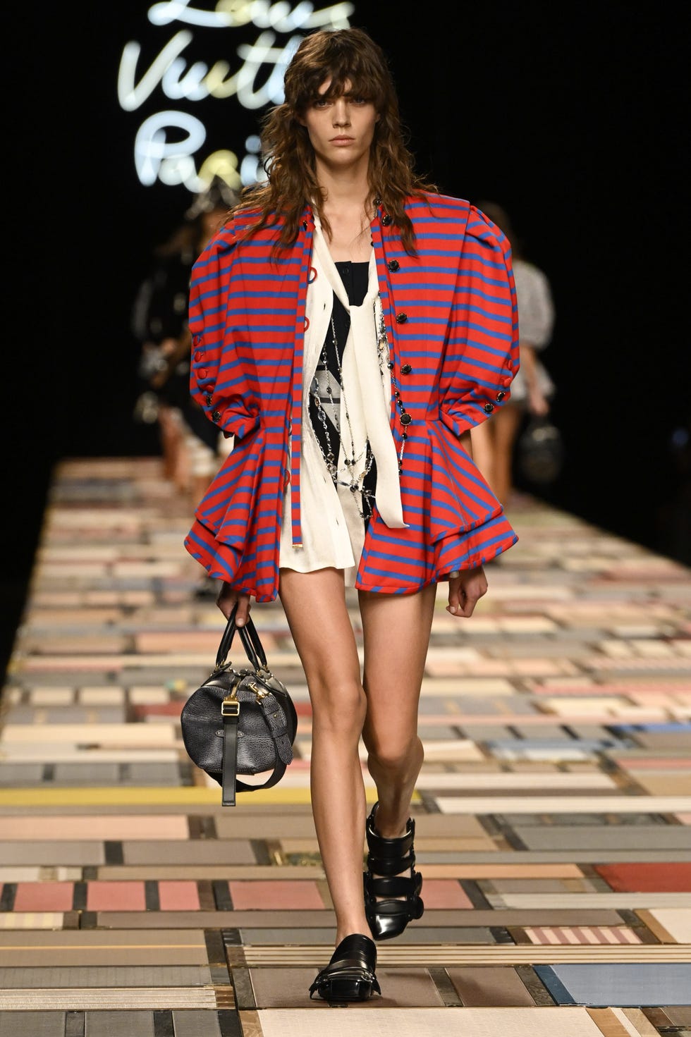 A model walks the runway at the Louis Vuitton Spring/Summer 2025 ready-to-wear fashion show as part of Paris Fashion Week on October 1, 2024 in Paris, France. (Photo by Victor Virgilegamma) Raffo, Getty Images)