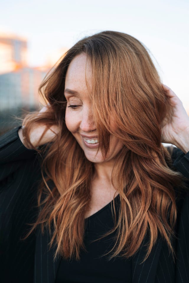 portrait of a red haired middle aged woman