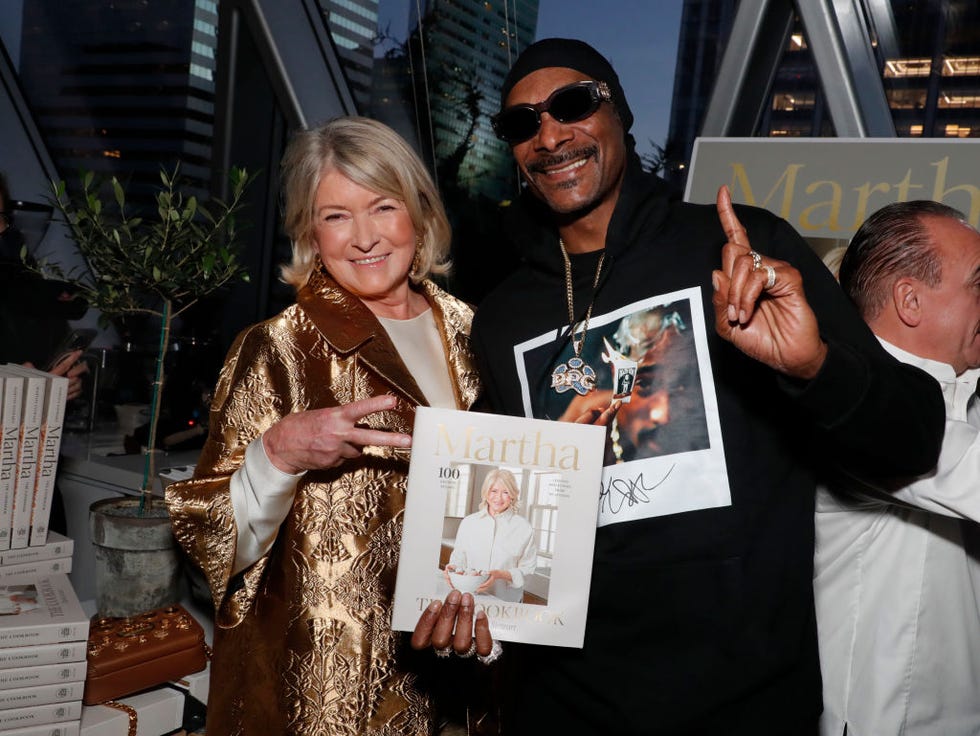new york, new york october 16 l r martha stewart and snoop dogg attend martha stewarts 100th book party celebration during food network new york city wine food festival presented by invesco qqq at four twenty five on october 16, 2024 in new york city photo by astrid stawiarzgetty images for nycwff