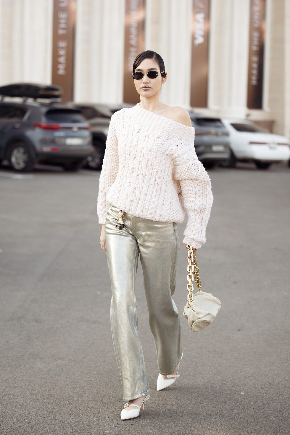 almaty, kazakhstan october 18 a guest wears silver pants, white sweater, white bag and white pointy shoes during the 10th season of the visa fashion week almaty on october 18, 2024 in almaty, kazakhstan photo by raimonda kulikauskienegetty images