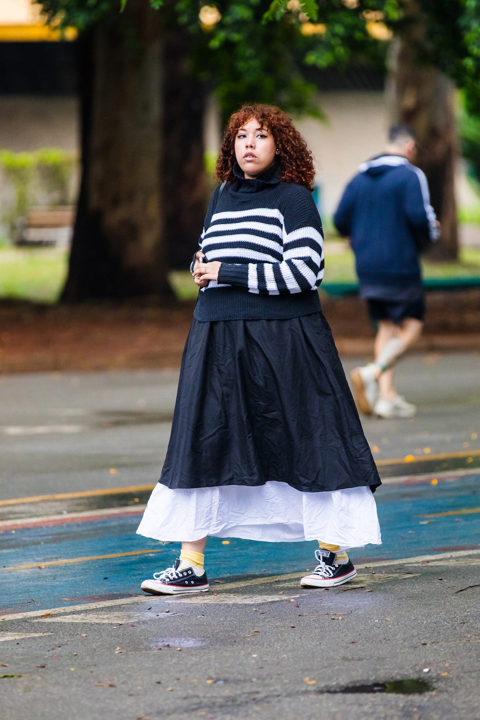 sao paulo, brazil october 20 a guest wears striped black and white turtleneck sweater, black layered skirt, white underlayer skirt, yellow socks, black converse sneakers at sao paulo fashion week 2024 n58 street style at parque ibirapuera on october 20, 2024 in sao paulo, brazil photo by mauricio santanagetty images