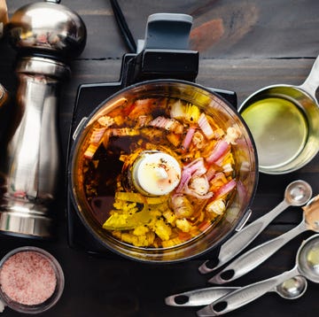 Unblended Vinaigrette Ingredients in a Mini Prep olive oil and vinegar based dressing in a small food processor surrounded with other ingredients