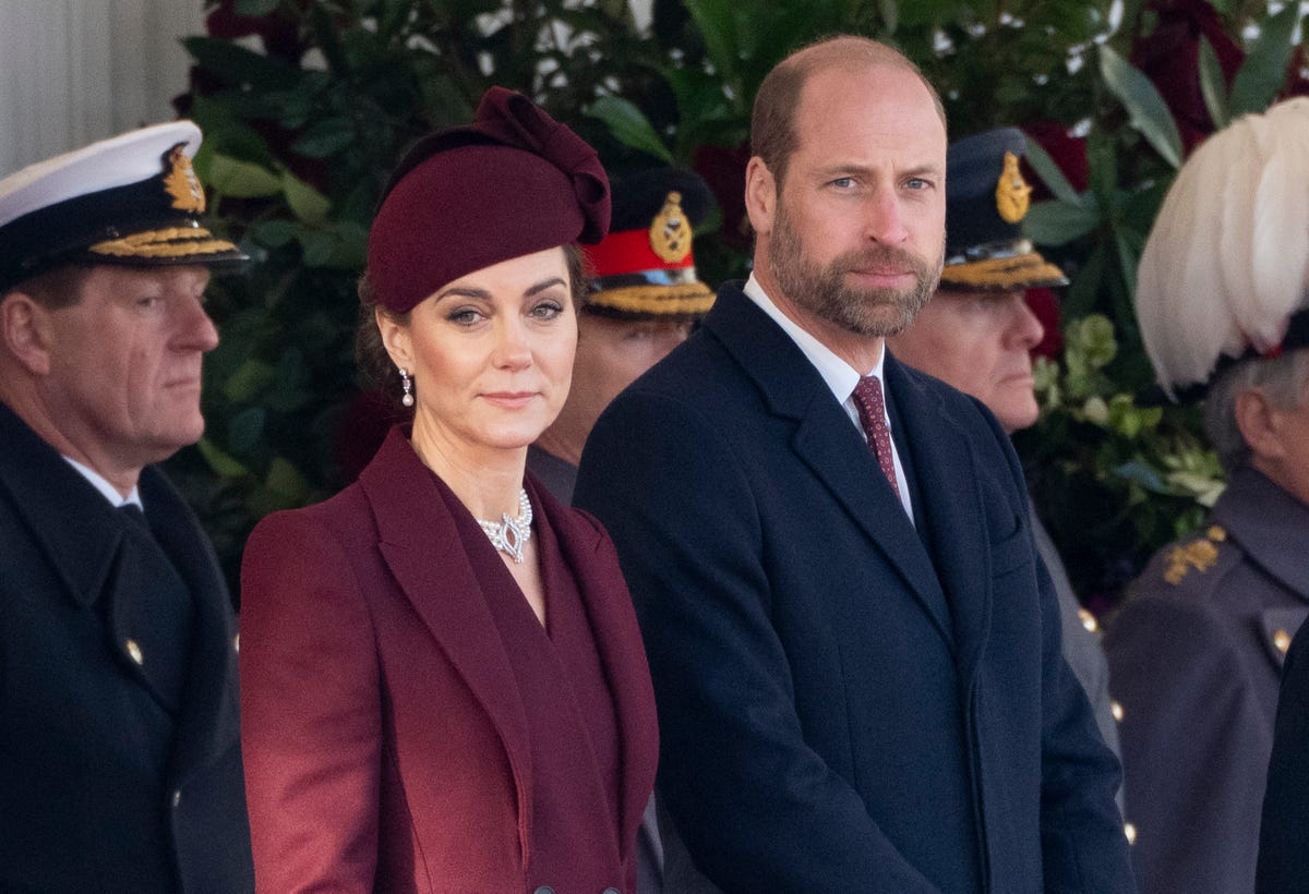 Kate Middleton Pairs a Burgundy Coat Dress With the Queen’s Jewelry for Qatar State Visit