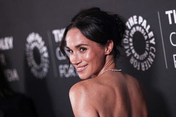 a woman with her back to the viewer showcasing a formal event setting