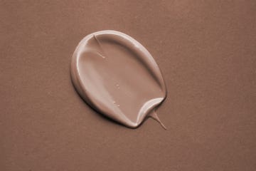 beige cosmetic cream swatch on a mocha color background color of the year 2025