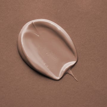 Beige cosmetic cream swatch on a Mocha color background. Color of the Year 2025. beige cosmetic cream swatch on a mocha color background color of the year 2025