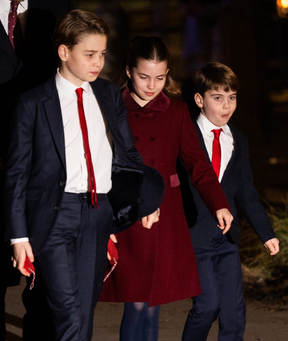 group of children dressed in formal attire walking together