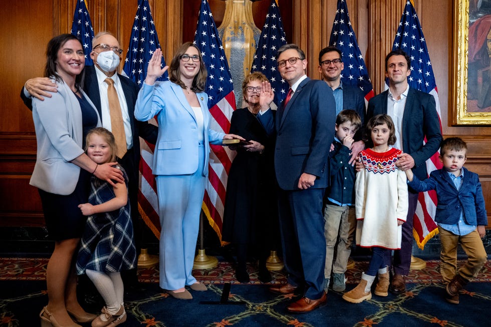 ceremony involving an official oathtaking with family present