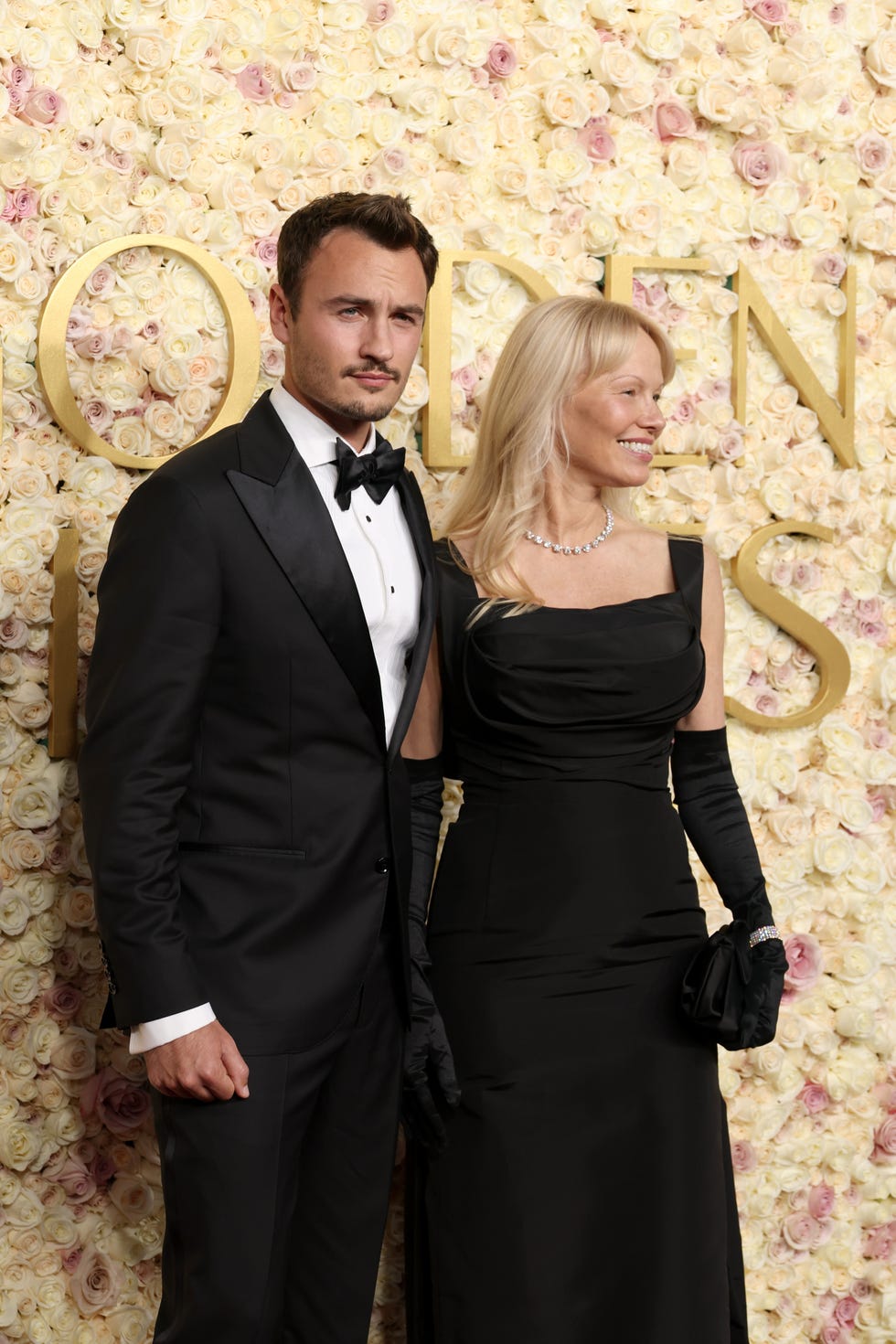 beverly hills, california january 05 l r brandon thomas lee and pamela anderson attend the 82nd annual golden globe awards at the beverly hilton on january 05, 2025 in beverly hills, california photo by kevin mazurgetty images