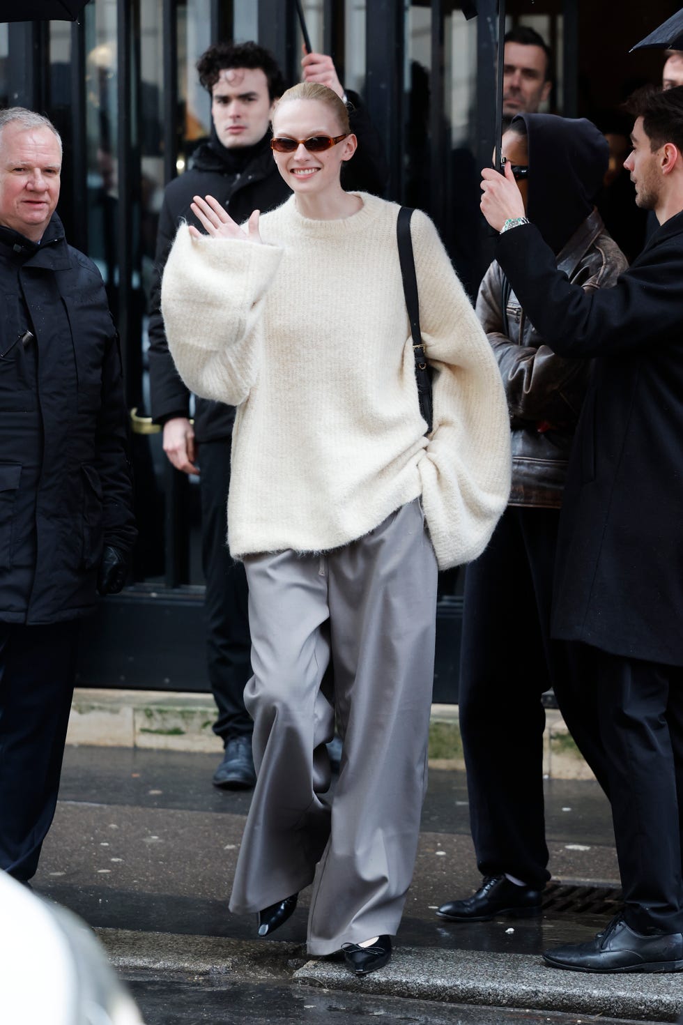 paris, france january 26 alex consani wears cream jumper, grey trousers, black heels, outside jacquemus, during the menswear fall winter 20252026 as part of paris fashion week on january 26, 2025 in paris, france photo by claudio laveniagetty images