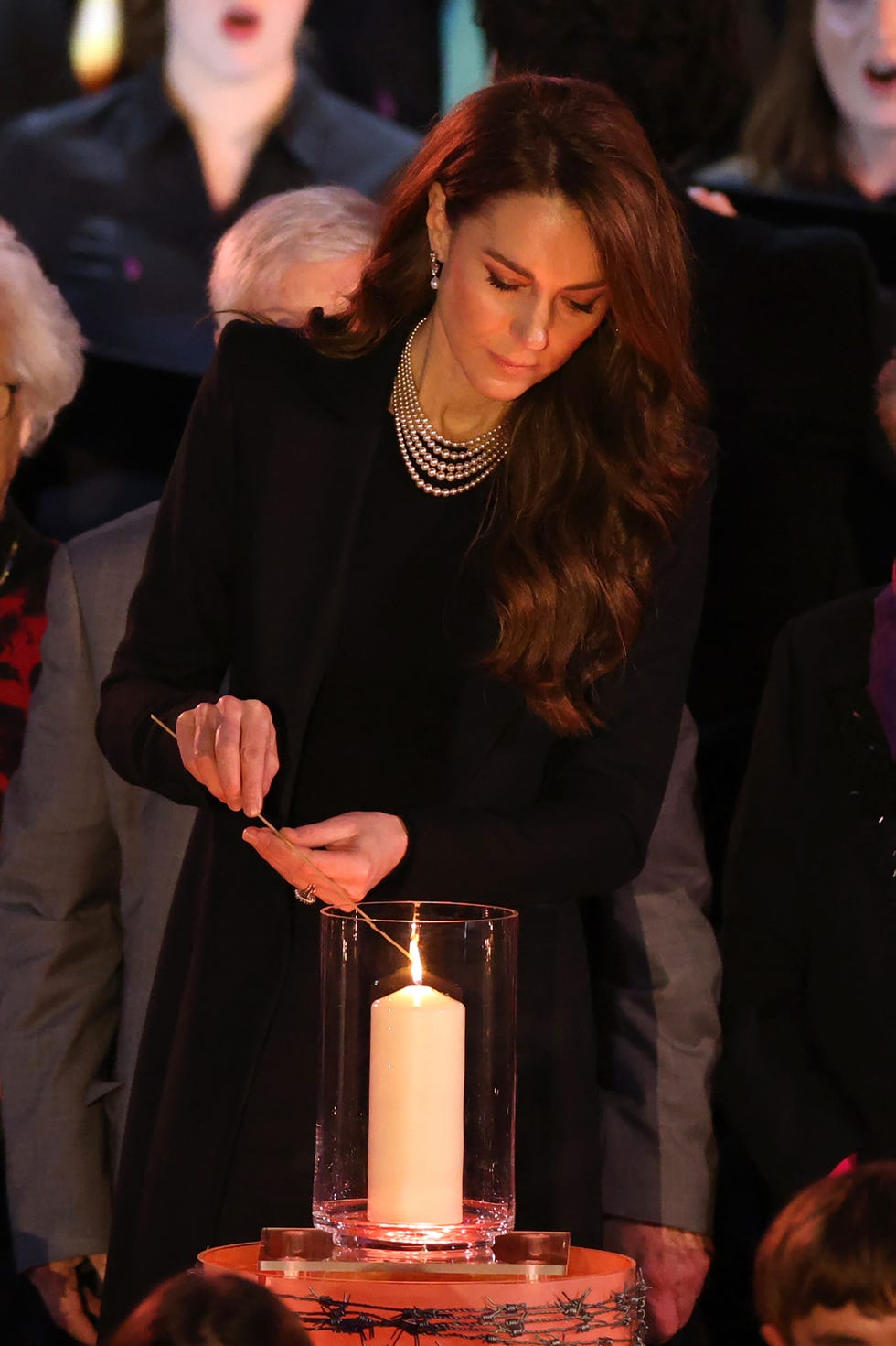 london, england january 27 catherine, princess of wales lights a candle during a ceremony commemorating holocaust memorial day on january 27, 2025 in london, england prime minister keir starmer and prince william were among the british officials and celebrities who marked holocaust memorial day and the 80th anniversary of the liberation of auschwitz birkenau during world war ii photo by dan kitwoodgetty images