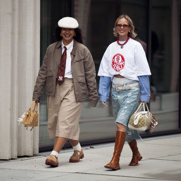Day 3 - Street Style - Copenhagen Fashion Week AW25 copenhagen, denmark january 29: a guest wears white shirt, burgundy tie, brown jacket, brown capri pants and beige bag and a guest wears denim shorts, brown shoes, blue shirt, white t shirt and light yellow bag outside the herskind fashion show during the copenhagen fashion week autumn/winter 2025 on january 29, 2025 in copenhagen, denmark. (photo by raimonda kulikauskiene/getty images)