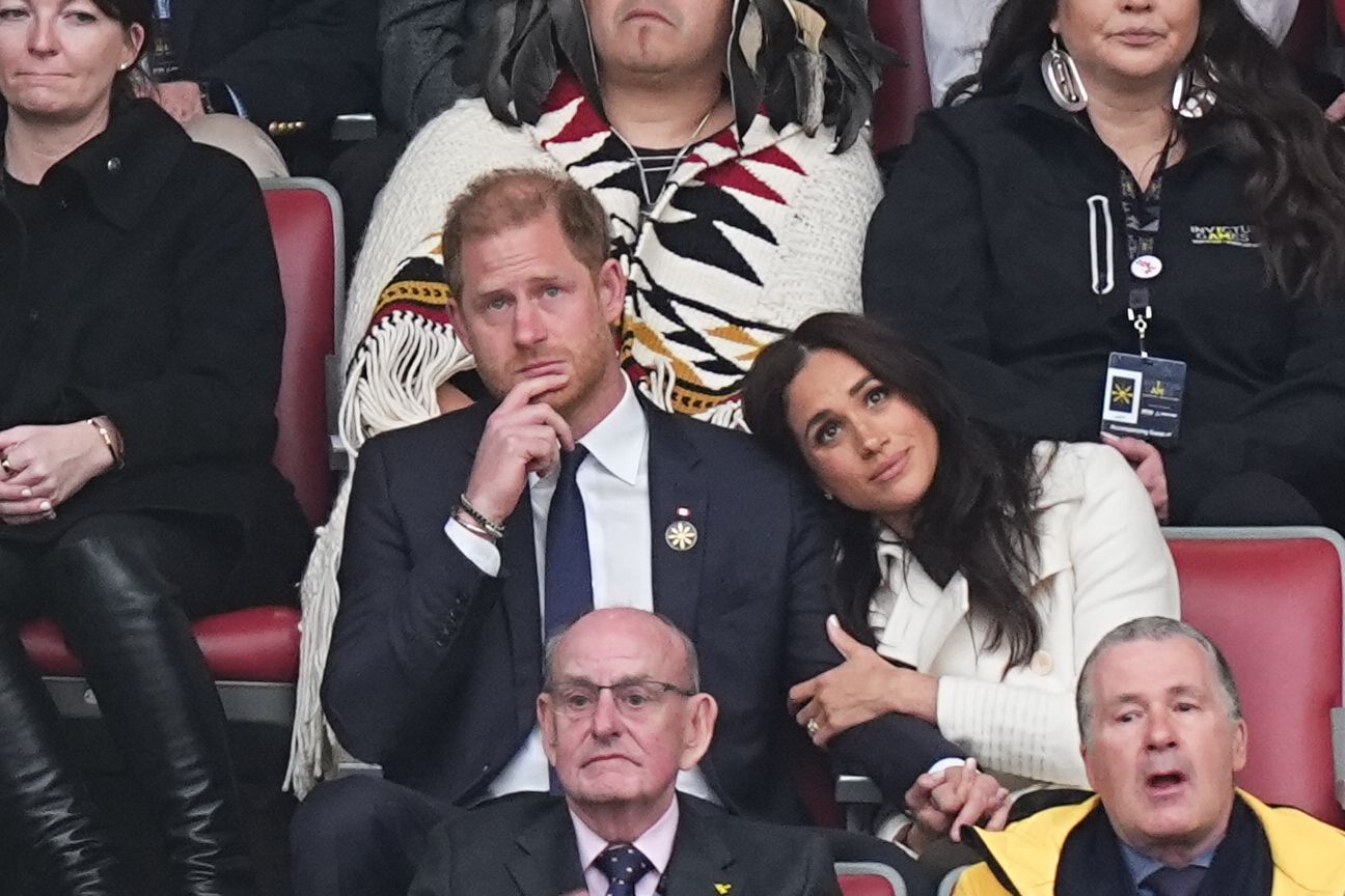 Duchess Meghan Slips Into a Pristine Ivory Coat for Her Third Look of the Day