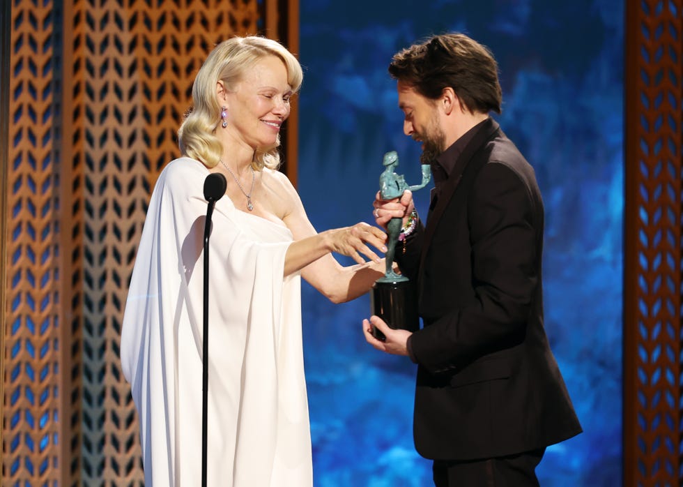 los angeles, california february 23 l r pamela anderson presents the outstanding performance by a male actor in a supporting role award for a real pain to kieran culkin onstage during the 31st annual screen actors guild awards at shrine auditorium and expo hall on february 23, 2025 in los angeles, california photo by matt winkelmeyergetty images