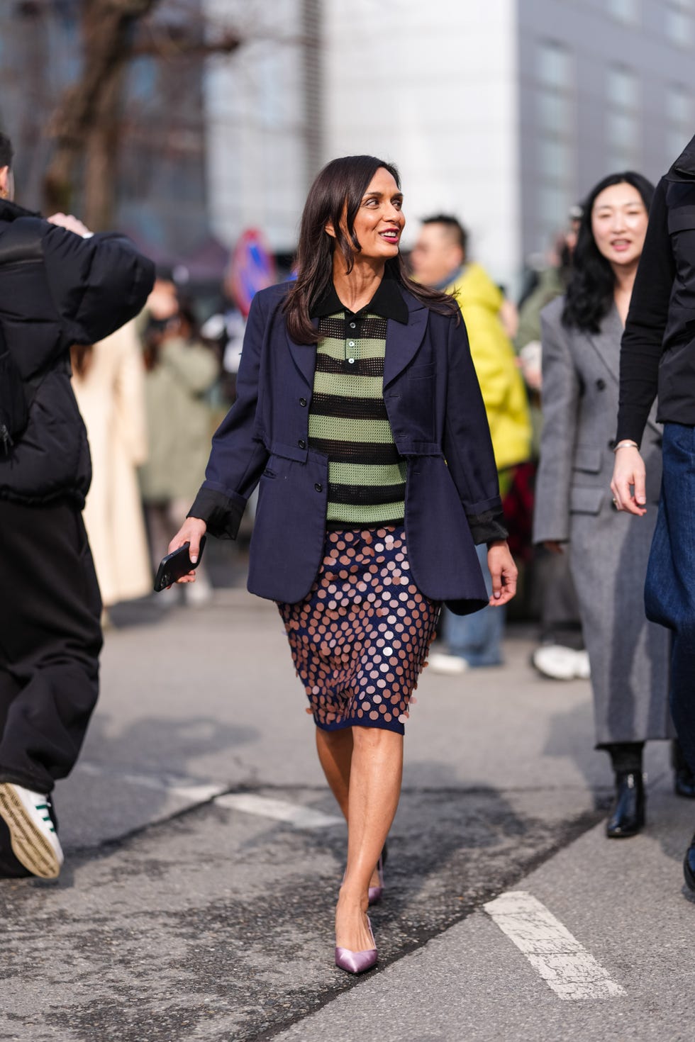 milan, italy february 26: a guest wears olive green black sheer mesh short sleeve shirt, dark blue jacket, dark navy blue dark pink embellished midi skirt, shiny dark pink pointed toe satin kitten heels, outside jil sander, during the milan fashion week womens fall/winter 2025 2026 on february 26, 2025 in milan, italy. (photo by edward berthelot/getty images)