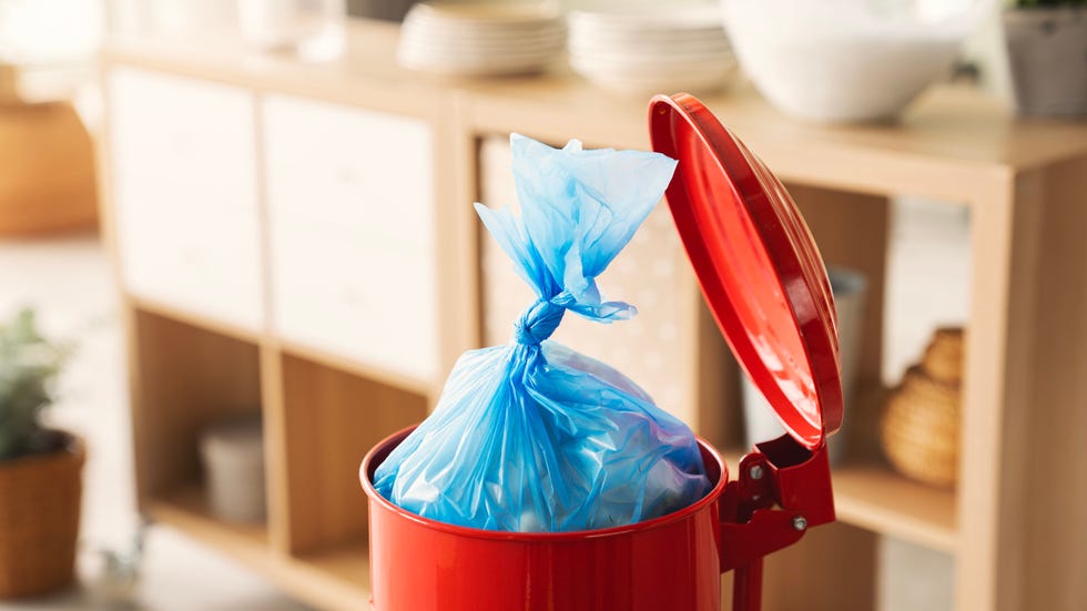 a full garbage bag in a kitchen