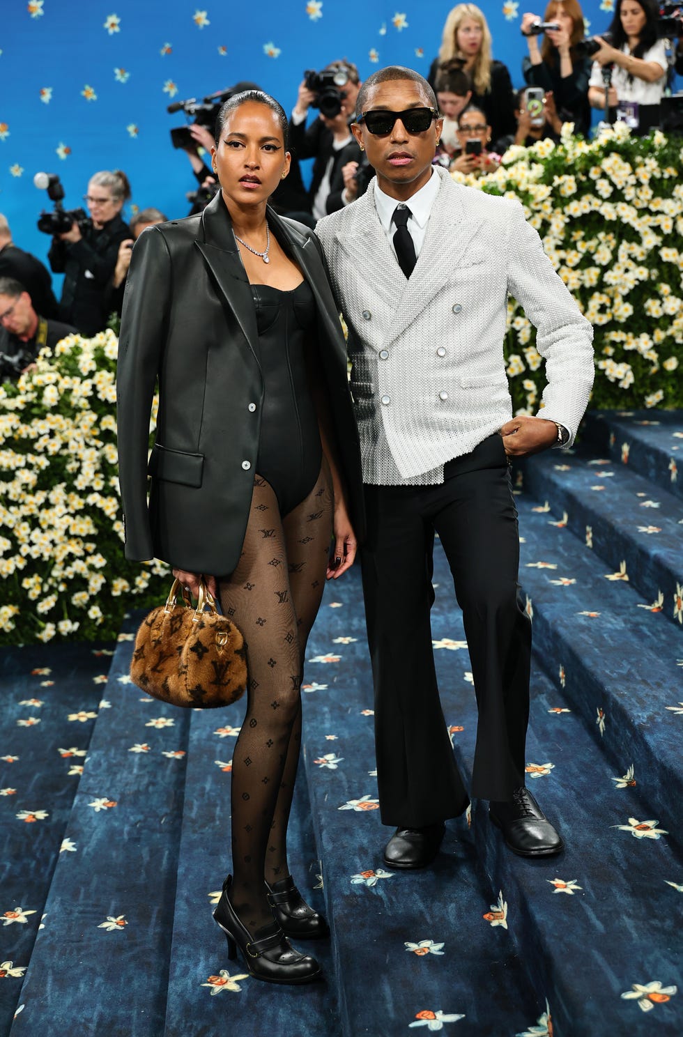 The 2025 Met Gala Celebrating "Superfine: Tailoring Black Style" - Arrivals new york, new york may 05: (l r) helen lasichanh and pharrell williams, met gala co chair attend the 2025 met gala celebrating superfine: tailoring black style at metropolitan museum of art on may 05, 2025 in new york city. (photo by theo wargo/filmmagic)