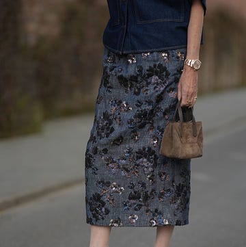 Street Style - Munich - April 2025 munich, germany april 16: annette weber is seen wearing a dark blue jeans blouse with short sleeves and chest pockets from agolde, a blue linen blend with flower sequin embroidery ludmilla maxi skirt from tt stories, emmanuelle 110 satin pumps in cappuccino brown with pointed toe from saint laurent, a bc duo mini bag in suede with monili in bark from brunello cuccinelli, a rosegold datejust lady watch, a rosegold ring with letter detail and further golden rings on april 16, 2025 in munich, germany. (photo by moritz scholz/getty images)