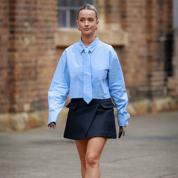 Street Style Day 4 - Australian Fashion Week 2025 sydney, australia may 15: a guest wearing blue tie detailed shirt, black mini skirt and black heels during australian fashion week 2025 on may 15, 2025 in sydney, australia. (photo by hanna lassen/getty images)