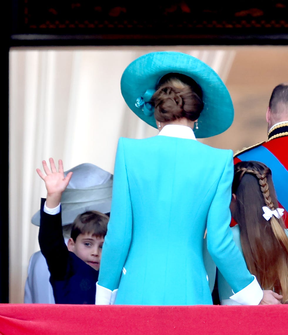 london, england june 14: prince louis of wales waves from the balcony and he heads inside with catherine, princess of wales, princess charlotte of wales and prince william, prince of wales during trooping the colour 2025 on june 14, 2025 in london, england. trooping the colour is a ceremonial parade celebrating the official birthday of the british monarch. the event features over 1,400 soldiers and officers, accompanied by 200 horses. more than 400 musicians from ten different bands and corps of drums march and while performing. (photo by chris jackson/getty images)