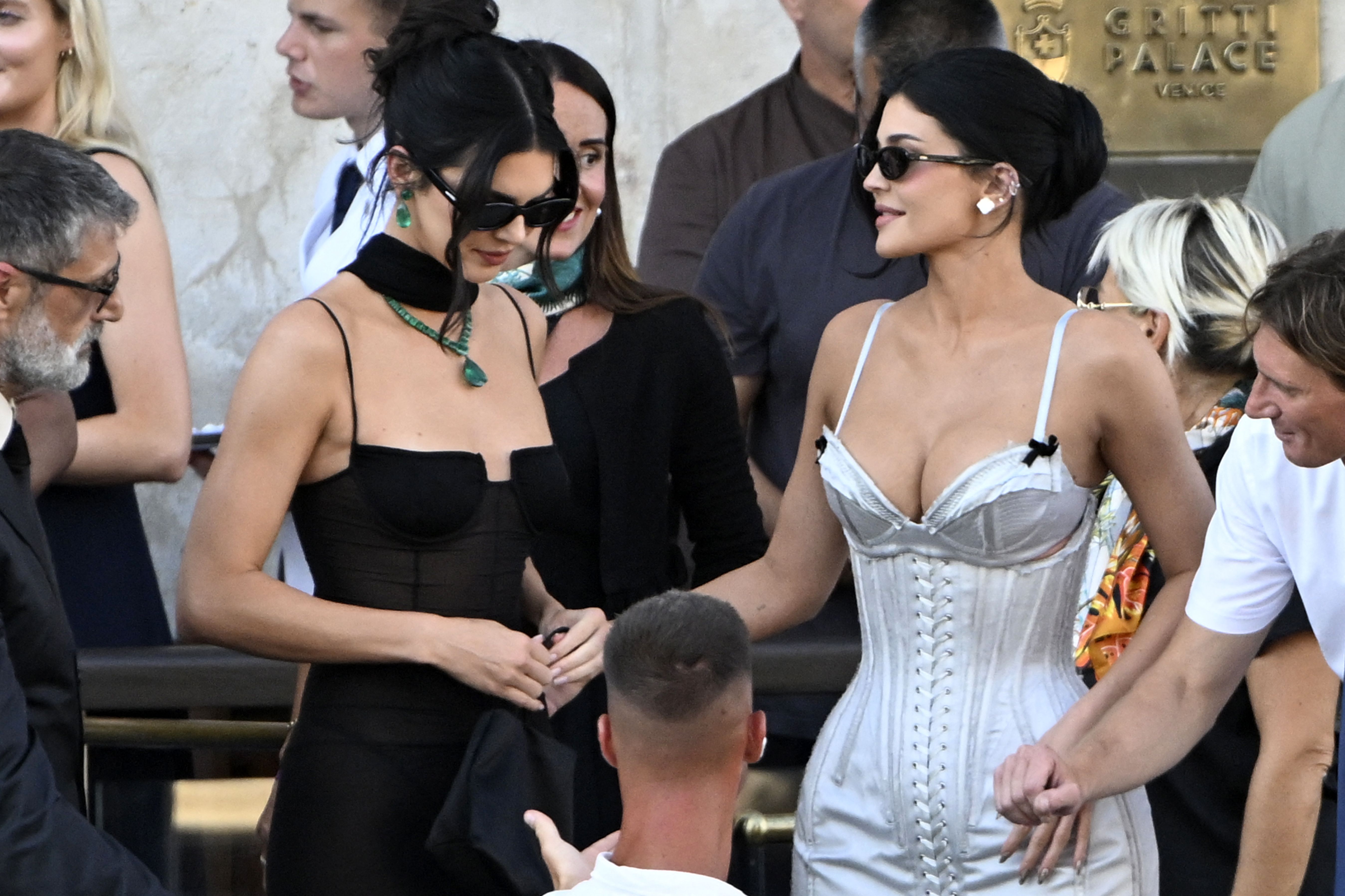 Kendall and Kylie Jenner Contrast in Black and Silver Looks for the Bezos Wedding