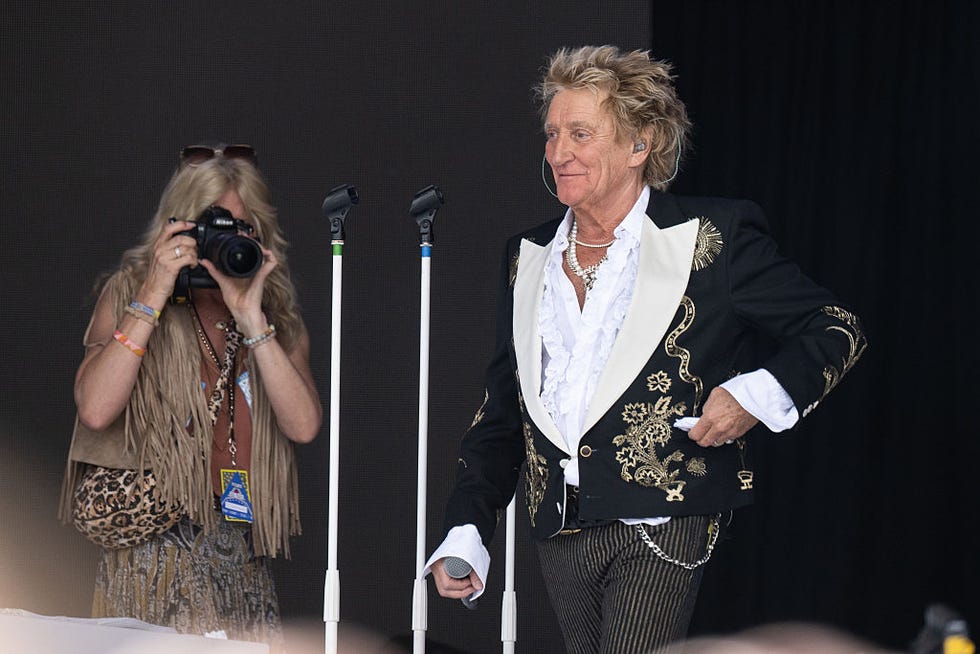 glastonbury, england june 29: (editors note: editorial use only strictly no commercial use no use in publication solely of rod stewart) penny lancaster photographs rod stewart as he performs on the pyramid stage during day five of glastonbury festival 2025 at worthy farm, pilton on june 29, 2025 in glastonbury, england. established by michael eavis in 1970, glastonbury has grown into the uks largest music festival, drawing over 200,000 fans to enjoy performances across more than 100 stages. in 2026, the festival will take a fallow year, a planned pause to allow the worthy farm site time to rest and recover. (photo by harry durrant/getty images)