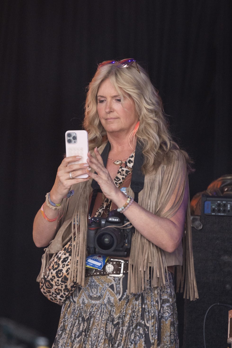glastonbury, england june 29: (editor's note: editorial use only strictly no commercial use no use in publication solely of rod stewart) penny lancaster photographs rod stewart as he performs on the pyramid stage during day five of glastonbury festival 2025 at worthy farm, pilton on june 29, 2025 in glastonbury, england. established by michael eavis in 1970, glastonbury has grown into the uk's largest music festival, drawing over 200,000 fans to enjoy performances across more than 100 stages. in 2026, the festival will take a fallow year, a planned pause to allow the worthy farm site time to rest and recover. (photo by harry durrant/getty images)