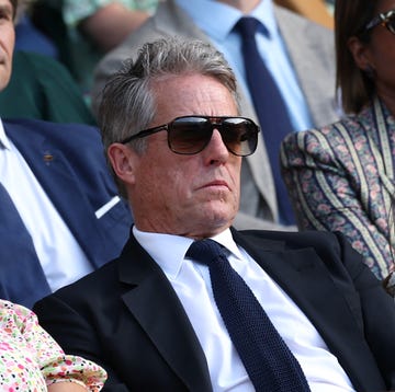 Day Ten: The Championships - Wimbledon 2025 london, england july 09: actor, hugh grant and anna elisabet eberstein watch in the royal box during the gentlemens singles quarter final match between flavio cobolli of italy and novak djokovic of serbia on day ten of the championships wimbledon 2025 at all england lawn tennis and croquet club on july 09, 2025 in london, england. (photo by clive brunskill/getty images)