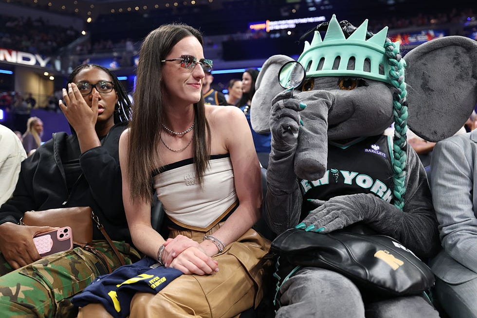 indianapolis, indiana july 18: (l r) caitlin clark #22 of the indiana fever reacts with new york liberty mascot ellie the elephant prior to the kia wnba skills challenge during the 2025 att wnba all star weekend at gainbridge fieldhouse on july 18, 2025 in indianapolis, indiana. note to user: user expressly acknowledges and agrees that, by downloading and or using this photograph, user is consenting to the terms and conditions of the getty images license agreement. (photo by steph chambers/getty images)