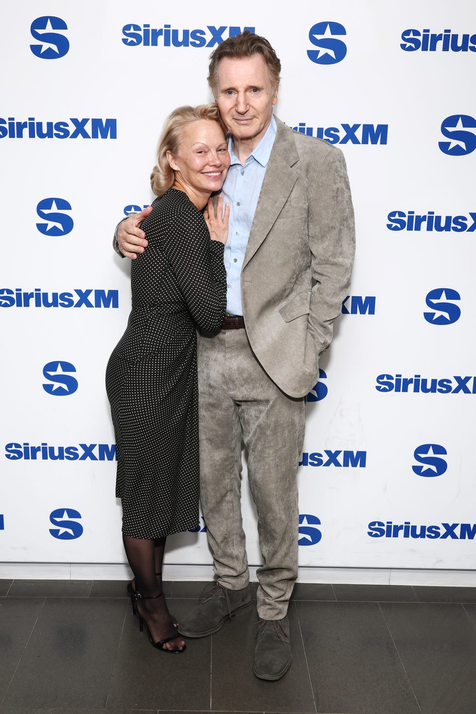 new york, new york july 30: pamela anderson and liam neeson attend siriusxms town hall with the cast of the naked gun hosted by andy cohen at siriusxm studios on july 30, 2025 in new york city. (photo by cindy ord/getty images for siriusxm)