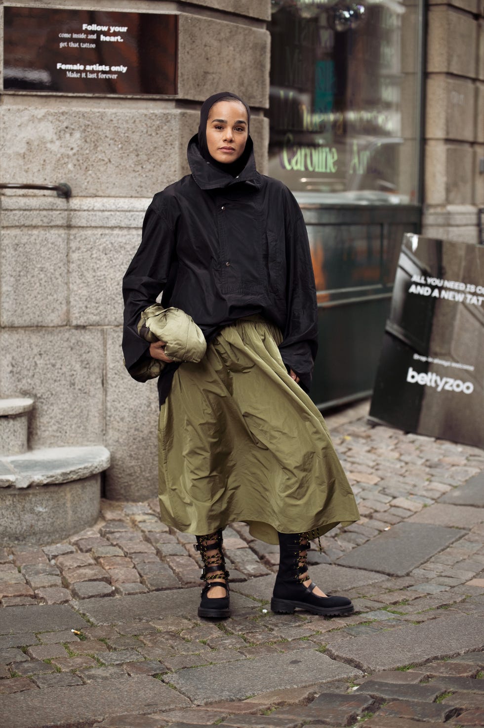 copenhagen, denmark august 04: a guest wears army green maxi skirt, black jacket, green bag, black shoes outside freya dalsjo show during copenhagen fashion week day one on august 04, 2025 in copenhagen, denmark. (photo by raimonda kulikauskiene/getty images)