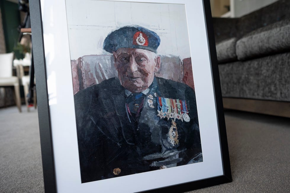 salisbury, england august 12: a portrait commissioned by king charles, then prince of wales, of 105 year old royal marines veteran james 'jim' wren is displayed at the old sarum manor care home in salisbury, ahead of the 80th anniversary of vj day on august 12, 2025 in salisbury, england. (photo by aaron chown wpa pool/getty images)