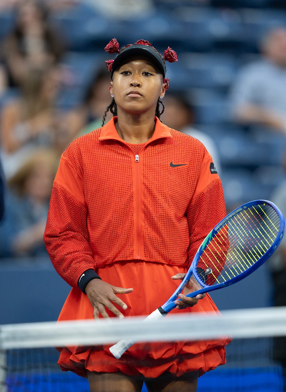 new york, new york august 25: naomi osaka of japan enters the court for her women's singles first round match on day three against greet minnen of belgium at the 2025 us open at usta billie jean king national tennis center on august 24, 2025 in new york city. (photo by susan mullane/isi photos/isi photos via getty images)