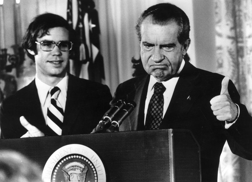 richard nixon gives the thumbs up after his resignation as 37th president of the united states his son in law david eisenhower is with him as he says goodbye to his staff at the white house, washington dc   photo by gene forteconsolidated news picturesgetty images