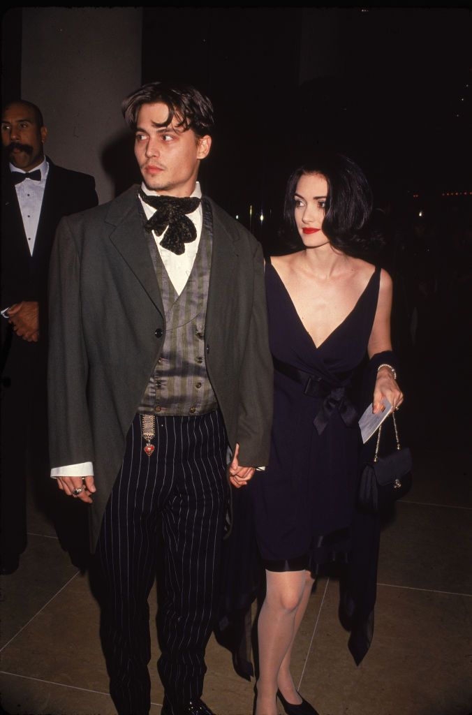 american actors johnny depp and winona ryder walk and hold hands as they attend an event, circa 1990 photo by darlene hammondgetty images