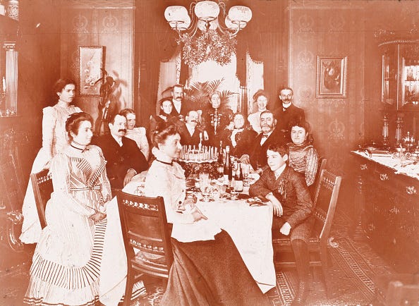 vintage photos of birthdays a group of fifteen people sit in a dining room with a birthday cake and candles on the table for a birthday party, circa 1897. (photo by jacob riis/museum of the city of new york/getty images)